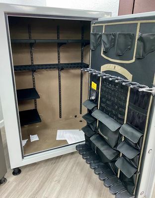 Open gun safe with shelves and door organizer; inside is empty.