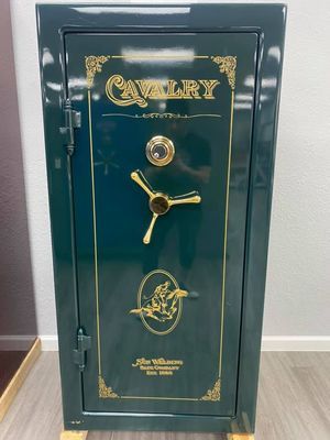 Green gun safe with gold accents and the word 