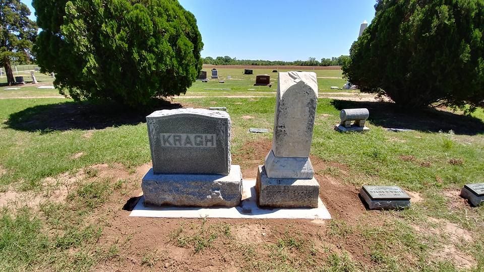 Two graves in a cemetery one of which has the name krause on it