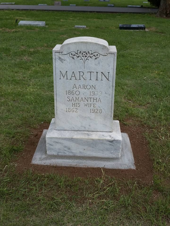 A gravestone for a man named martin is in a cemetery.