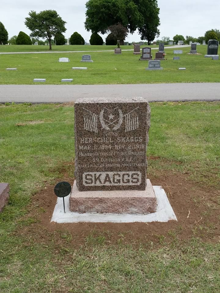 A gravestone in a cemetery with the name skaggs on it