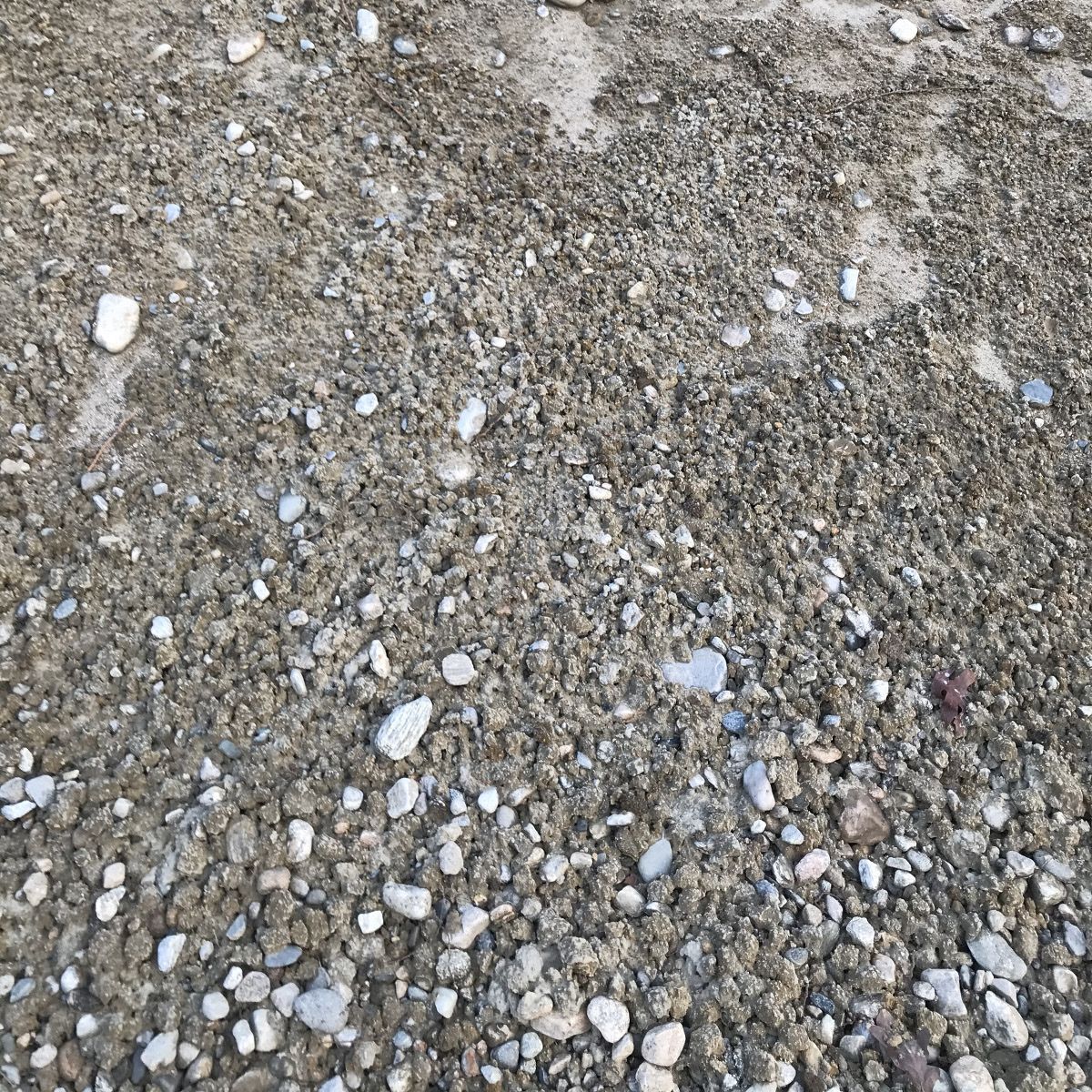 A pile of gravel and rocks on the ground.
