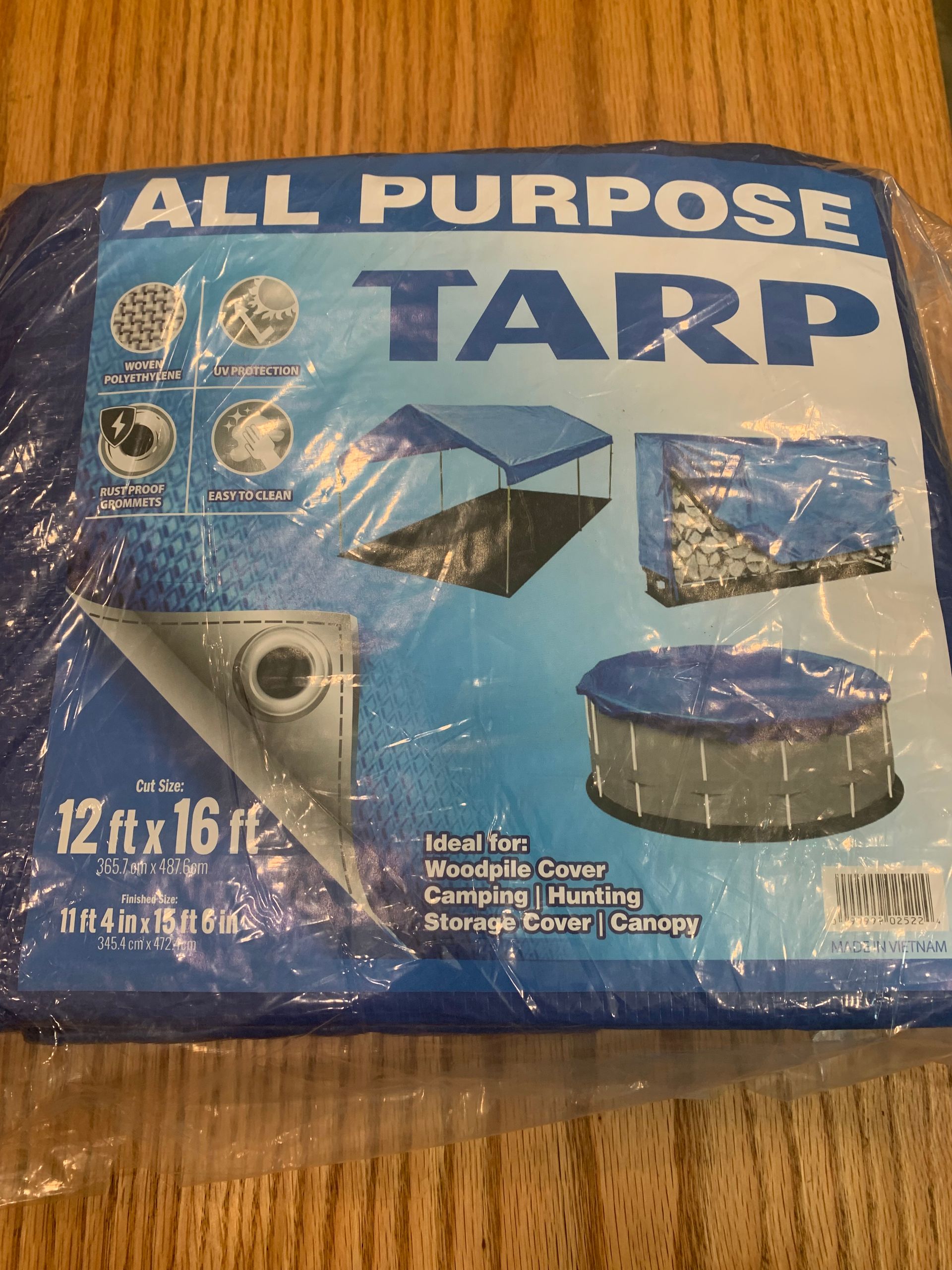 A blue tarp is sitting on a wooden table