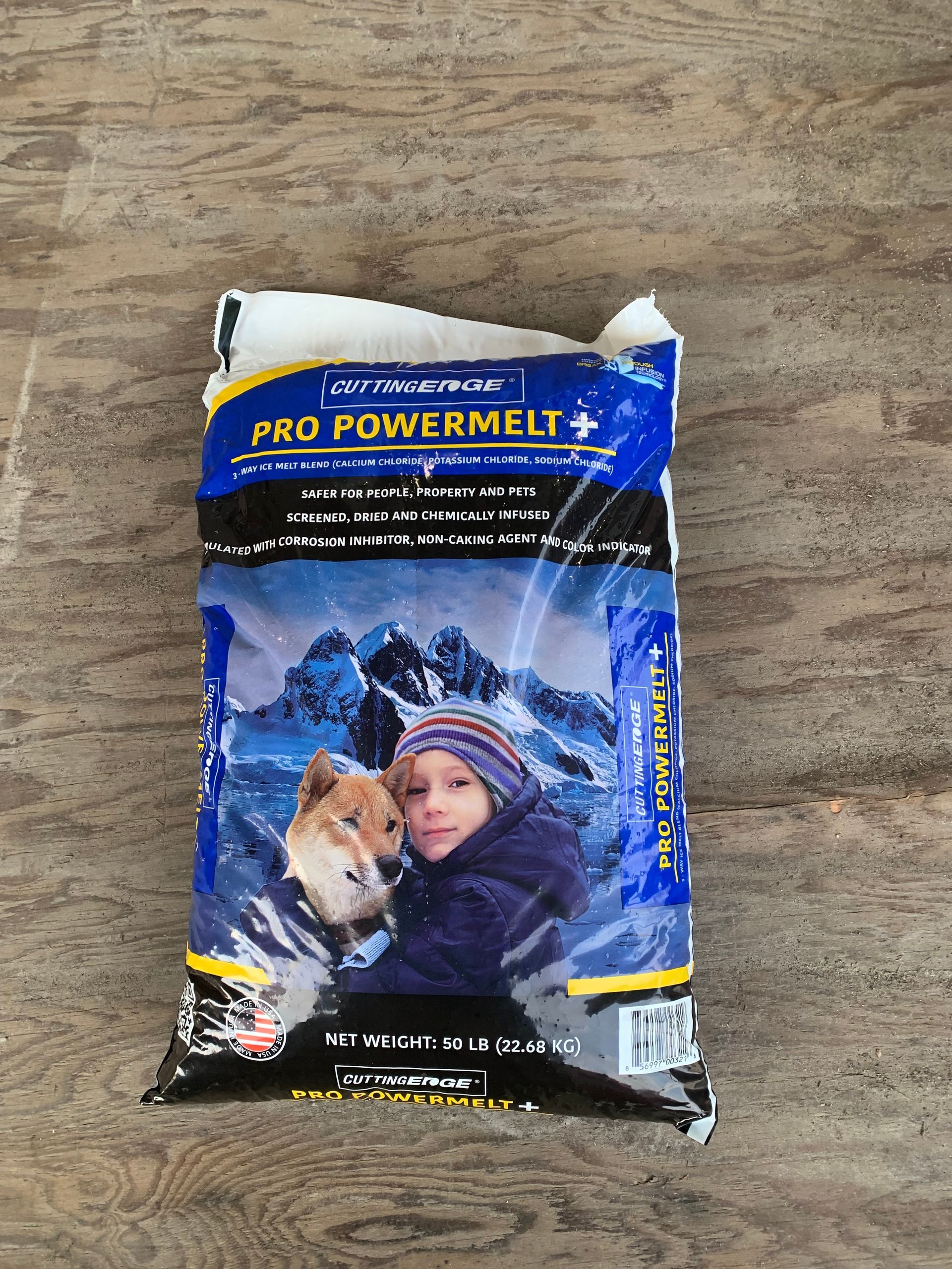 A bag of pro powermelt is sitting on a wooden table.