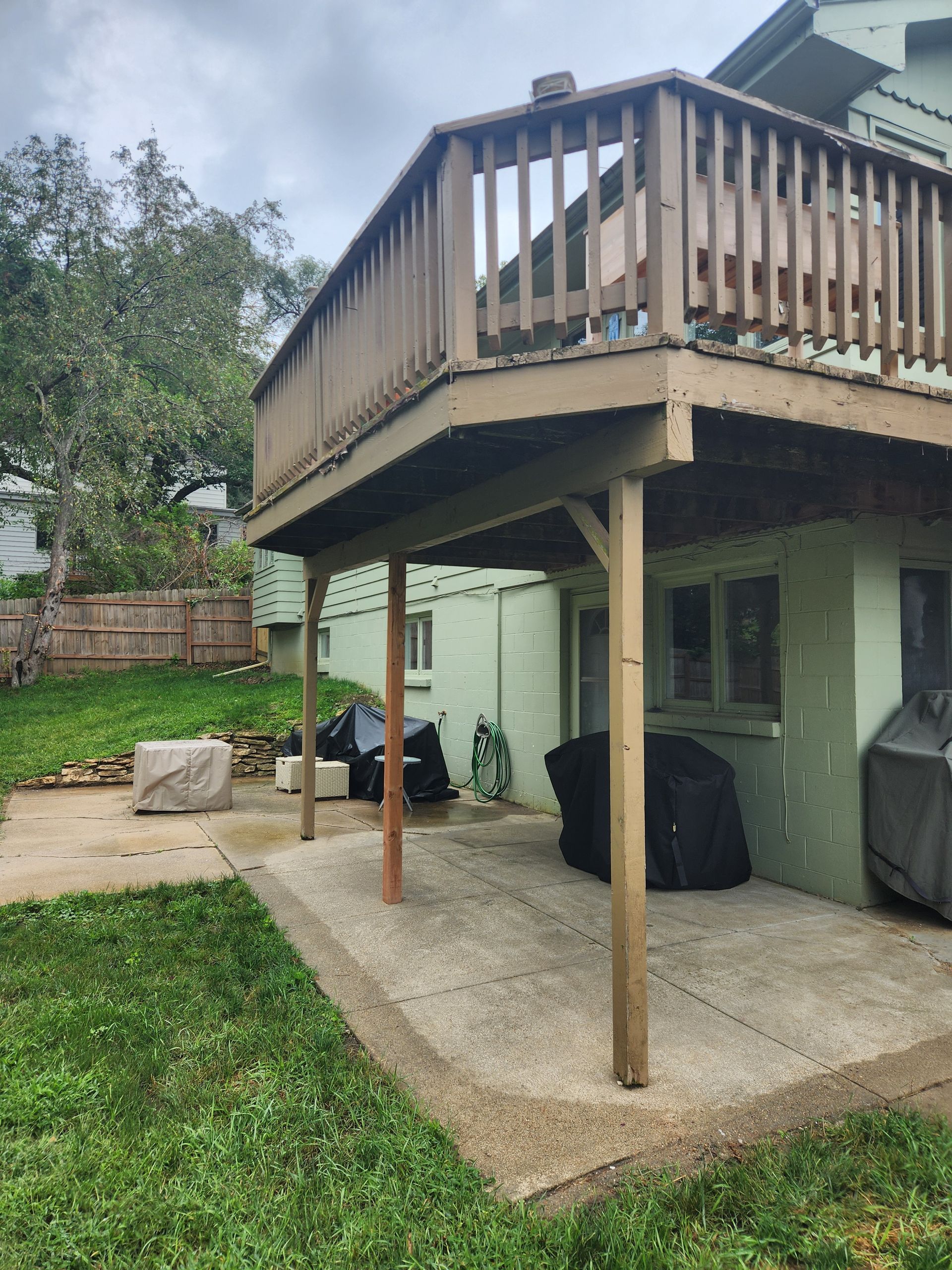 The backyard of a house with a large deck