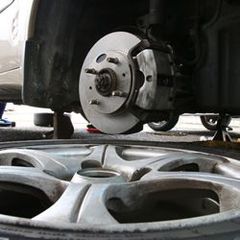 A close-up of a brake disc on a car wheel.