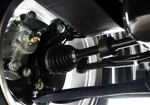 A close up of the suspension system of a car