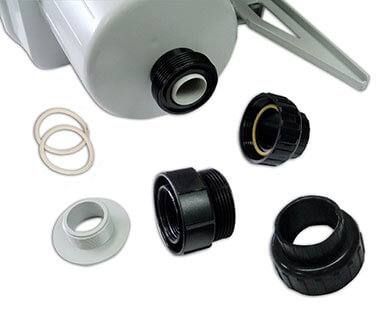 Assorted black and silver mechanical hose fittings and rings on a light background