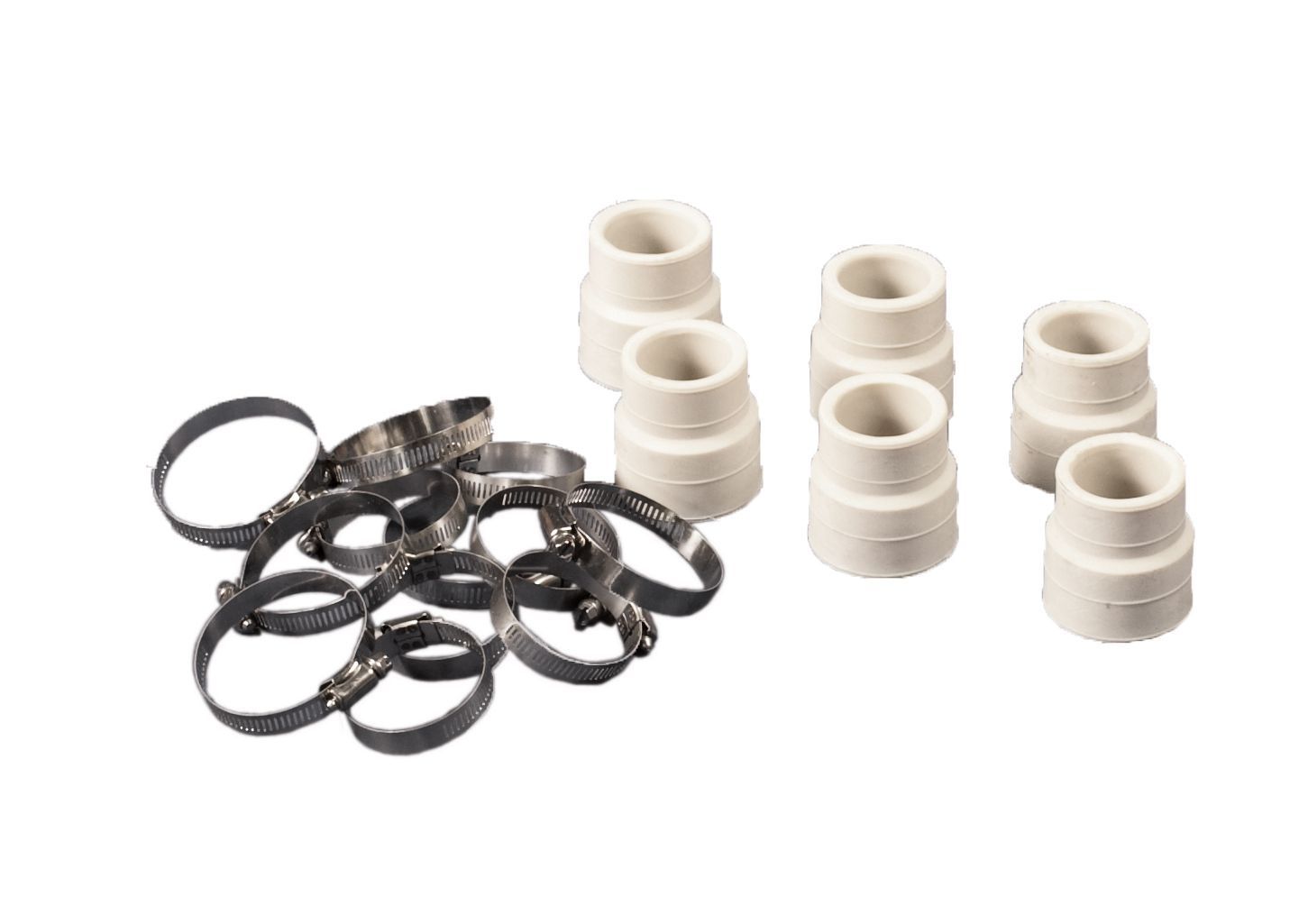 White plastic fittings and black rubber washers arranged on a plain white background
