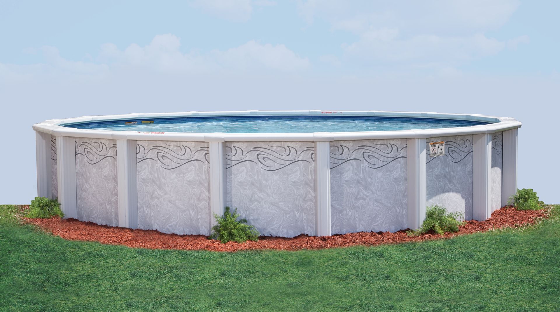 Above-ground round swimming pool with white panels, set on grass with a red mulch border against a blue sky