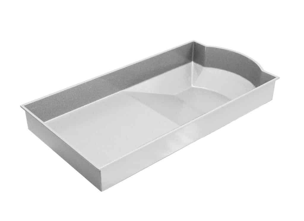 White rectangular metal baking tray with rounded corner and rolled rim