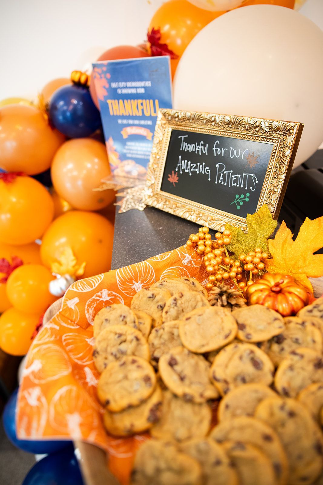 A tray of chocolate chip cookies is sitting on a table.