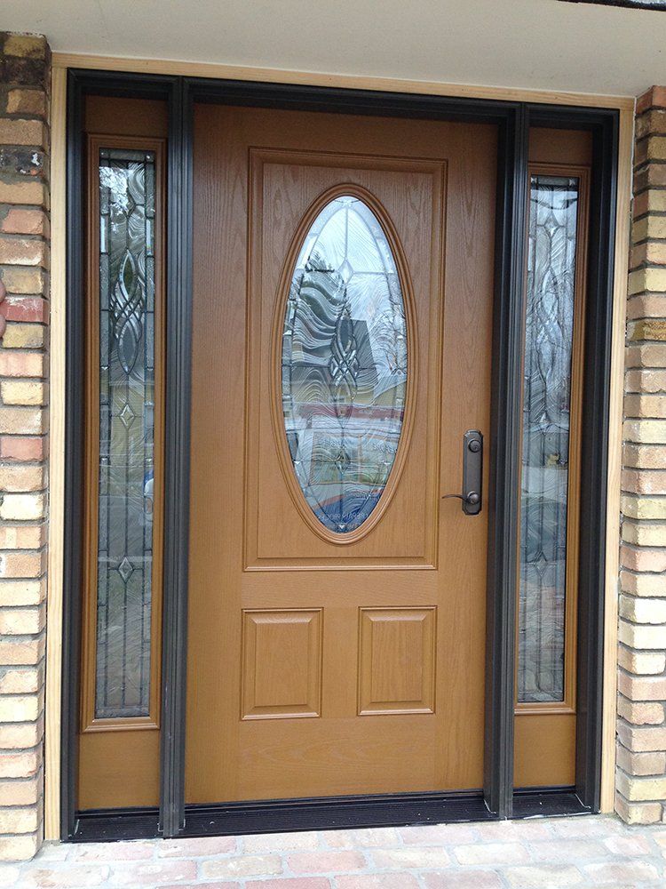 A brown front door with a stained glass window