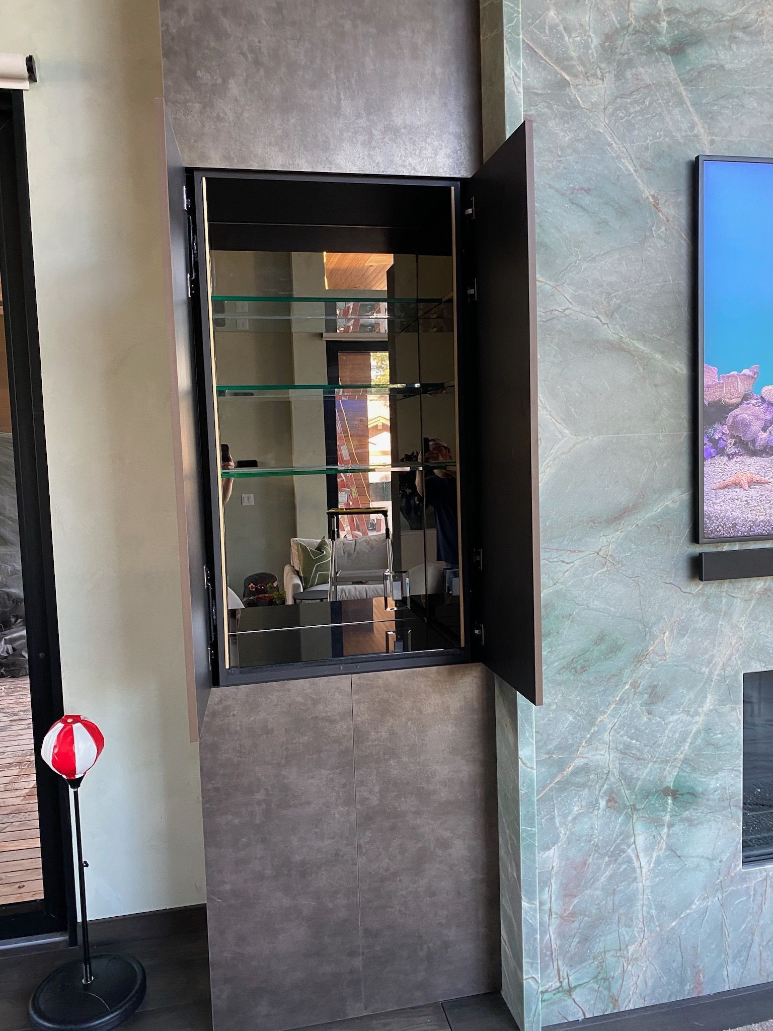 A kitchen with glass shelves