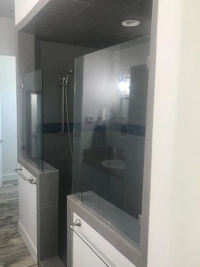 A bathroom with a walk-in shower