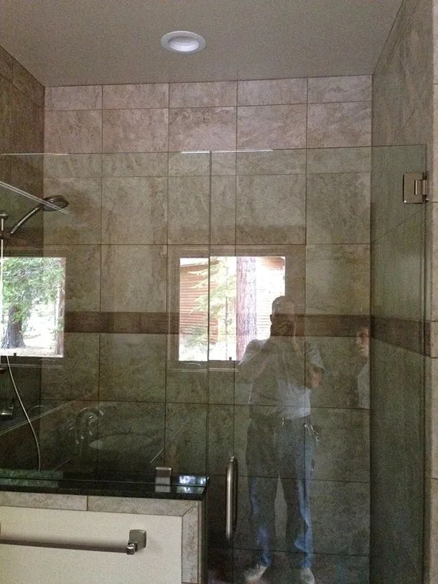 A shower with a glass enclosure