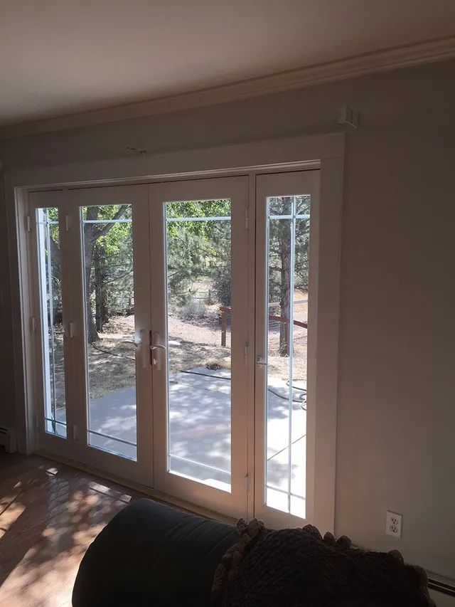 A living room with sliding glass doors leading to a patio
