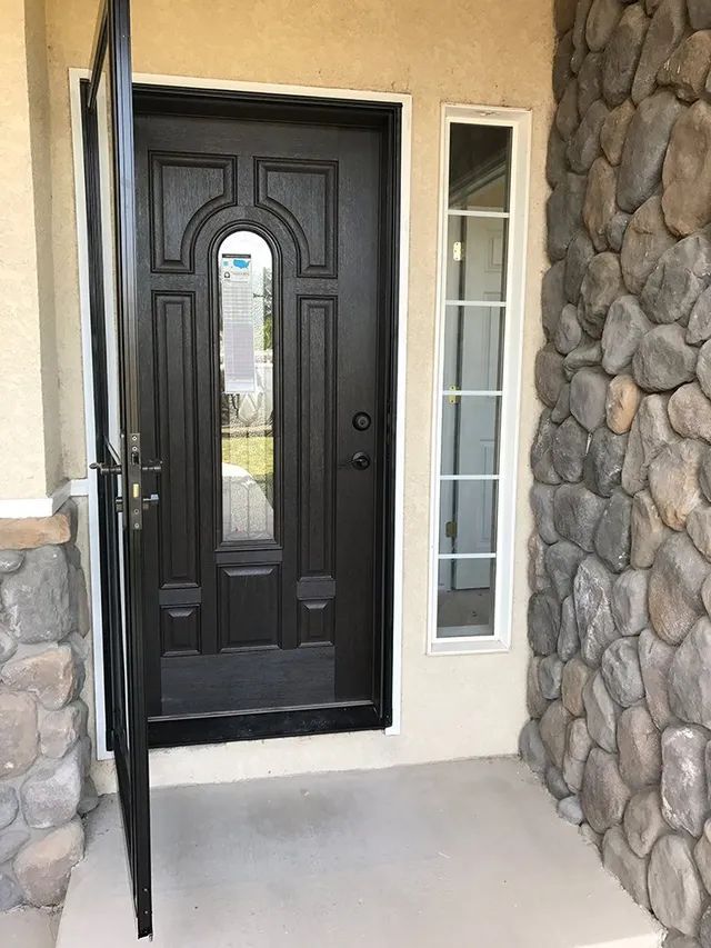 A black door with a glass window