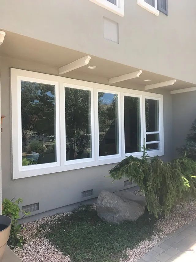 A house with a lot of windows on the side of it