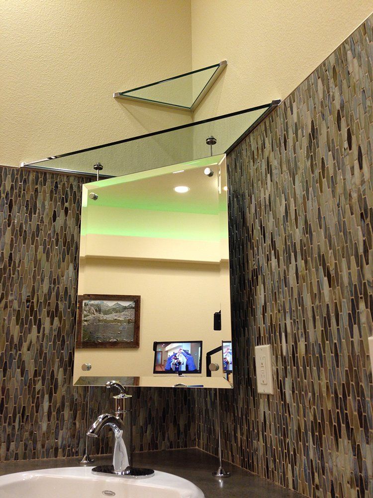 A bathroom with a sink and a large mirror