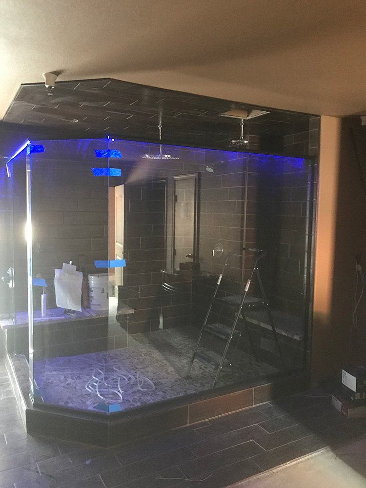 A room with a glass wall and a ladder in it