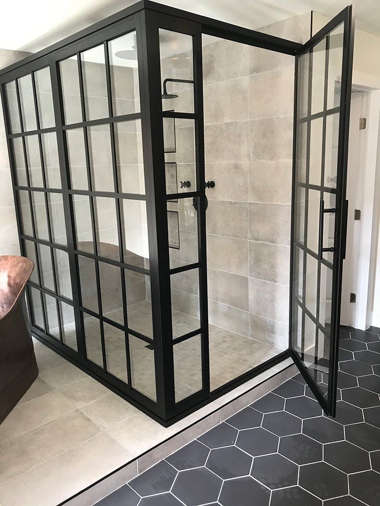 A room with a sliding glass door and a black frame