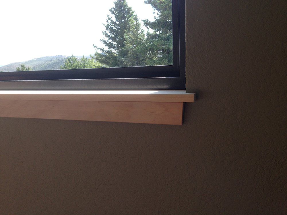 A window in a room with a view of trees