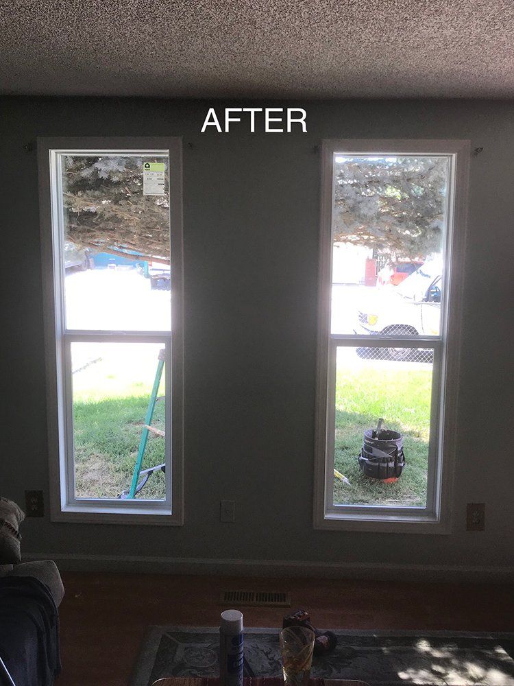 A living room with two windows