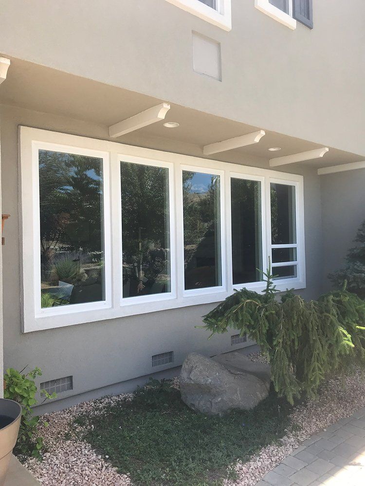 A house with a lot of windows on the side of it