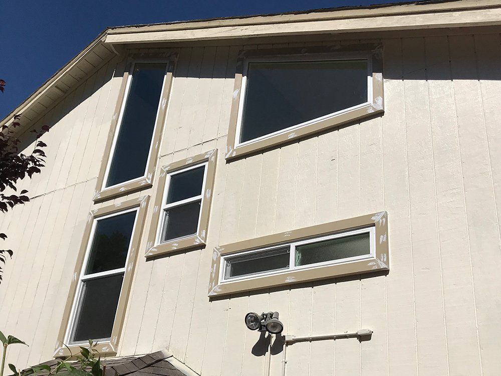 A house with a lot of windows on the side of it