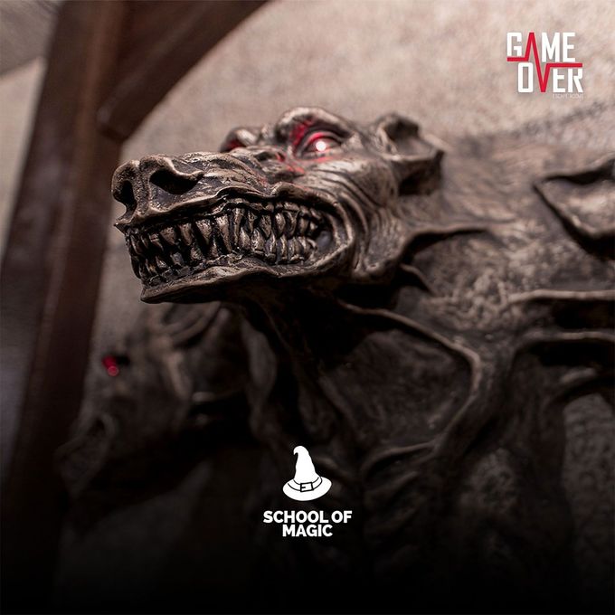 A statue of a monster with the words game over on it