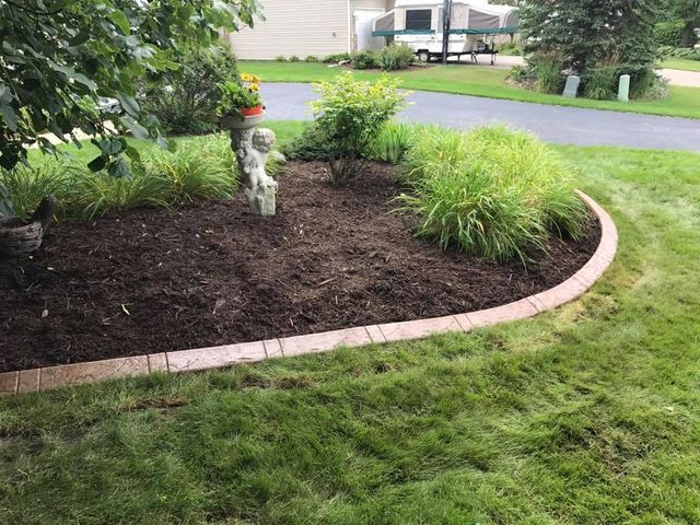 there is a statue in the middle of the garden .