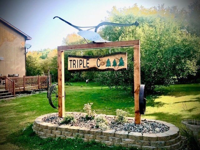 a wooden sign that says triple c on it