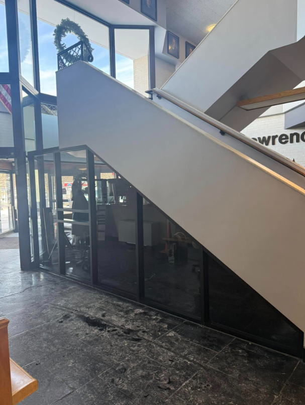 A building with stairs and a sign that says wrench