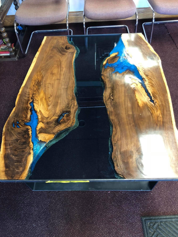 A wooden table with a river flowing through it