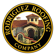 Circular logo for Rodriguez Roofing Company featuring a stylized illustration of a house with a red tile roof.