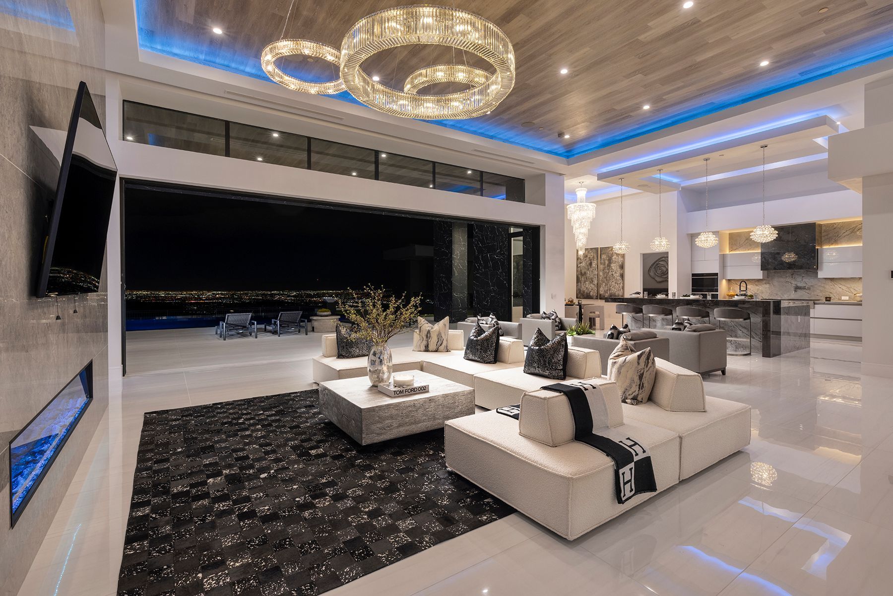 A living room filled with furniture and a chandelier.