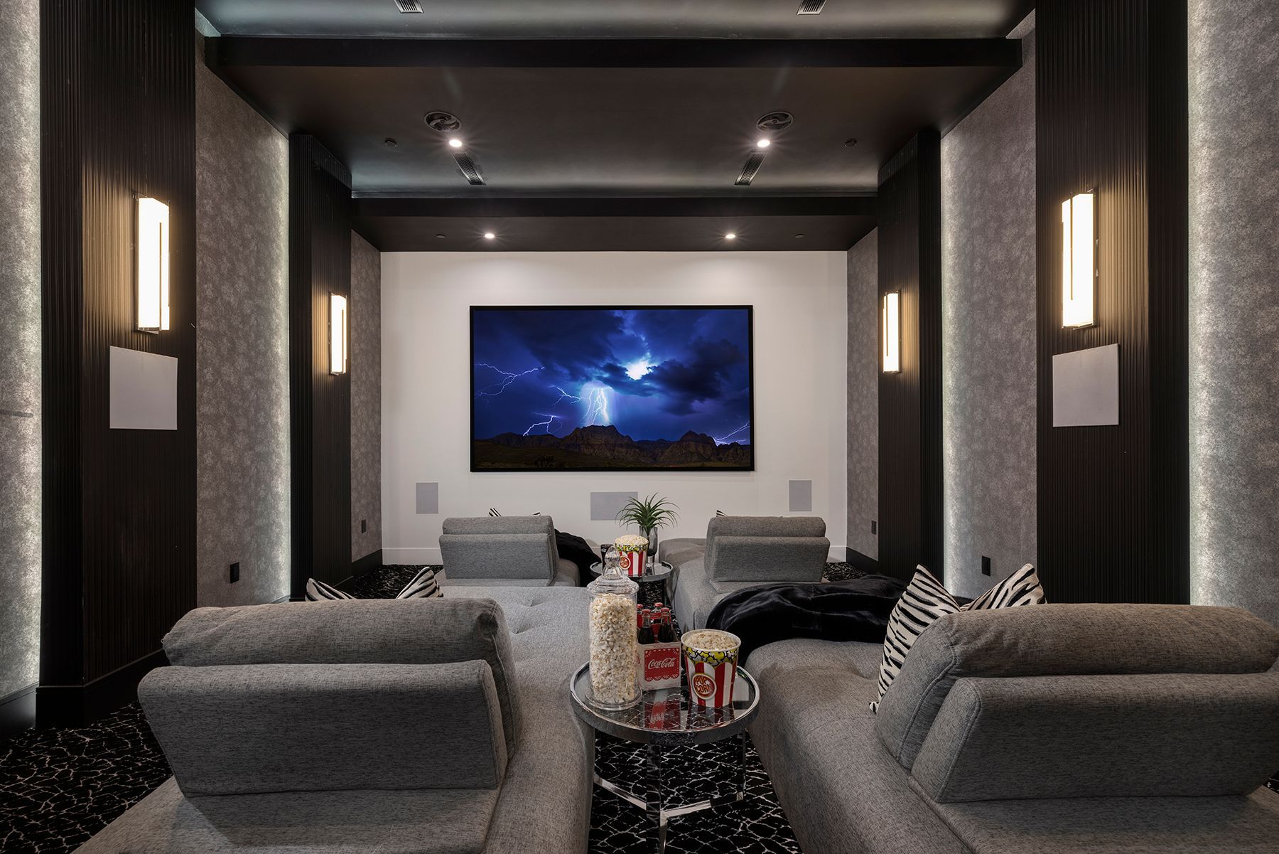 A home theater with a large flat-screen tv.