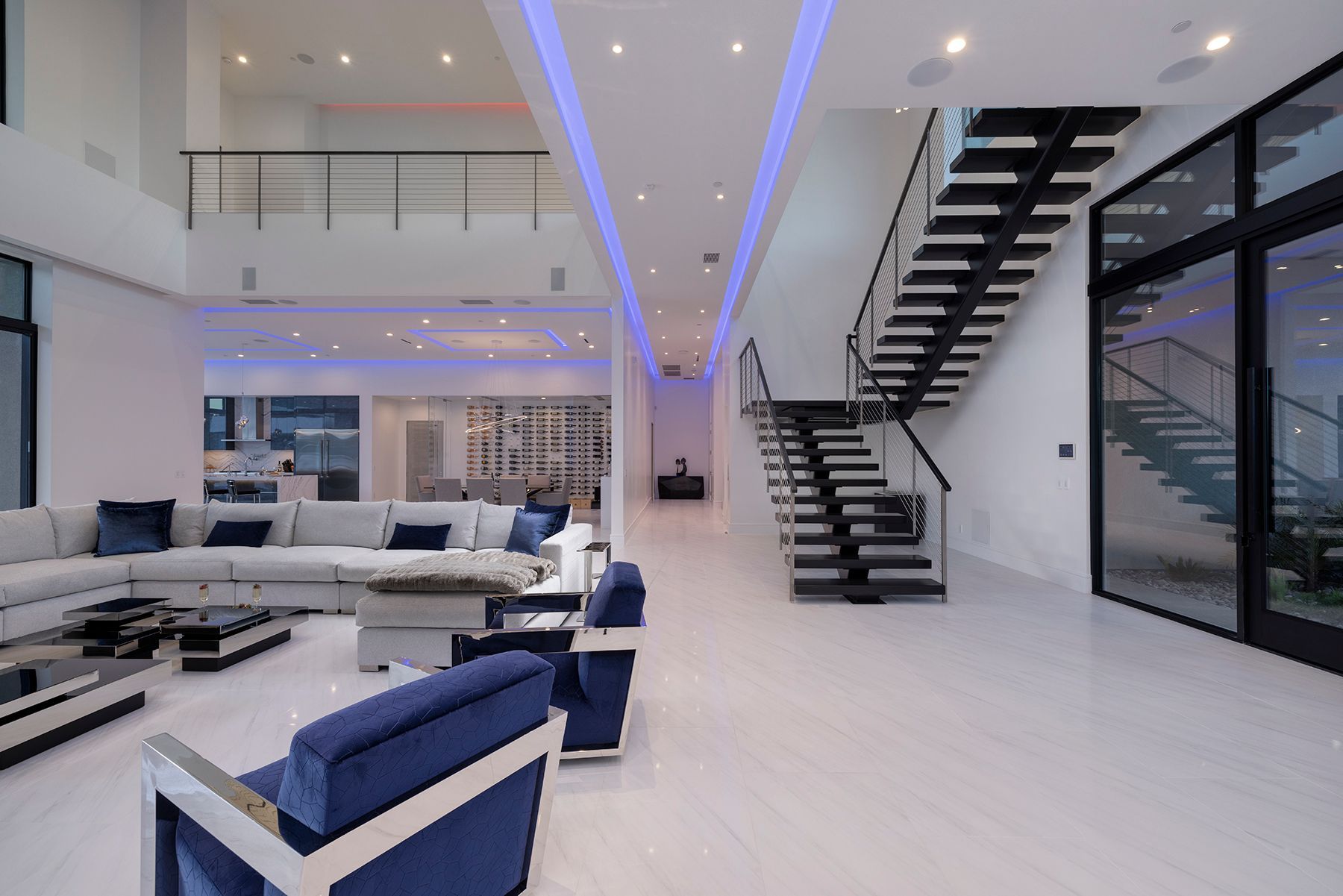 There is a staircase in the middle of the living room.