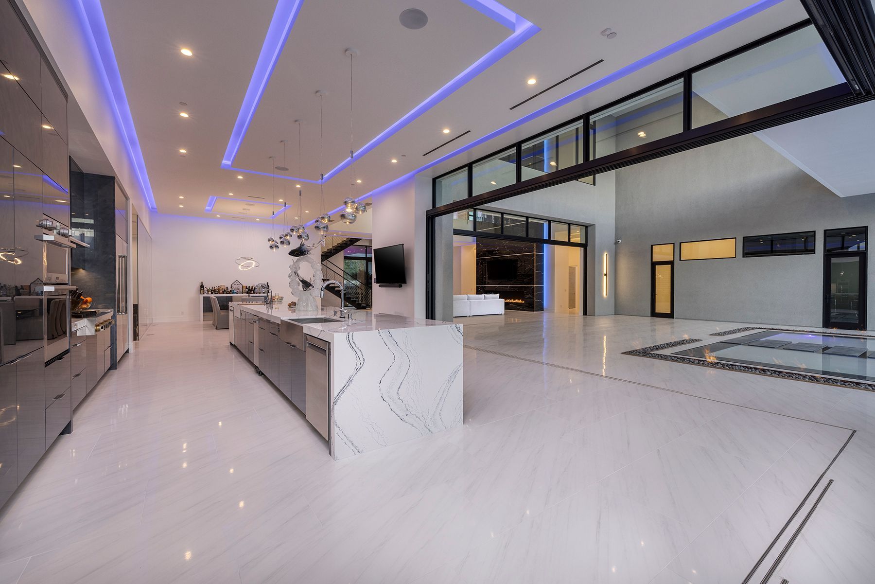 A large kitchen with a large island in the middle of the room.