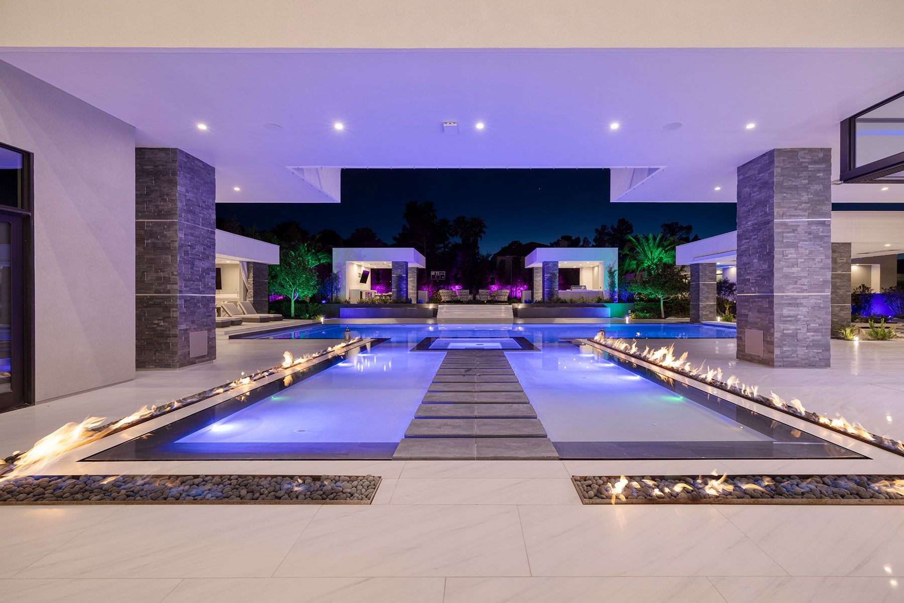 There is a large swimming pool in the middle of the house.