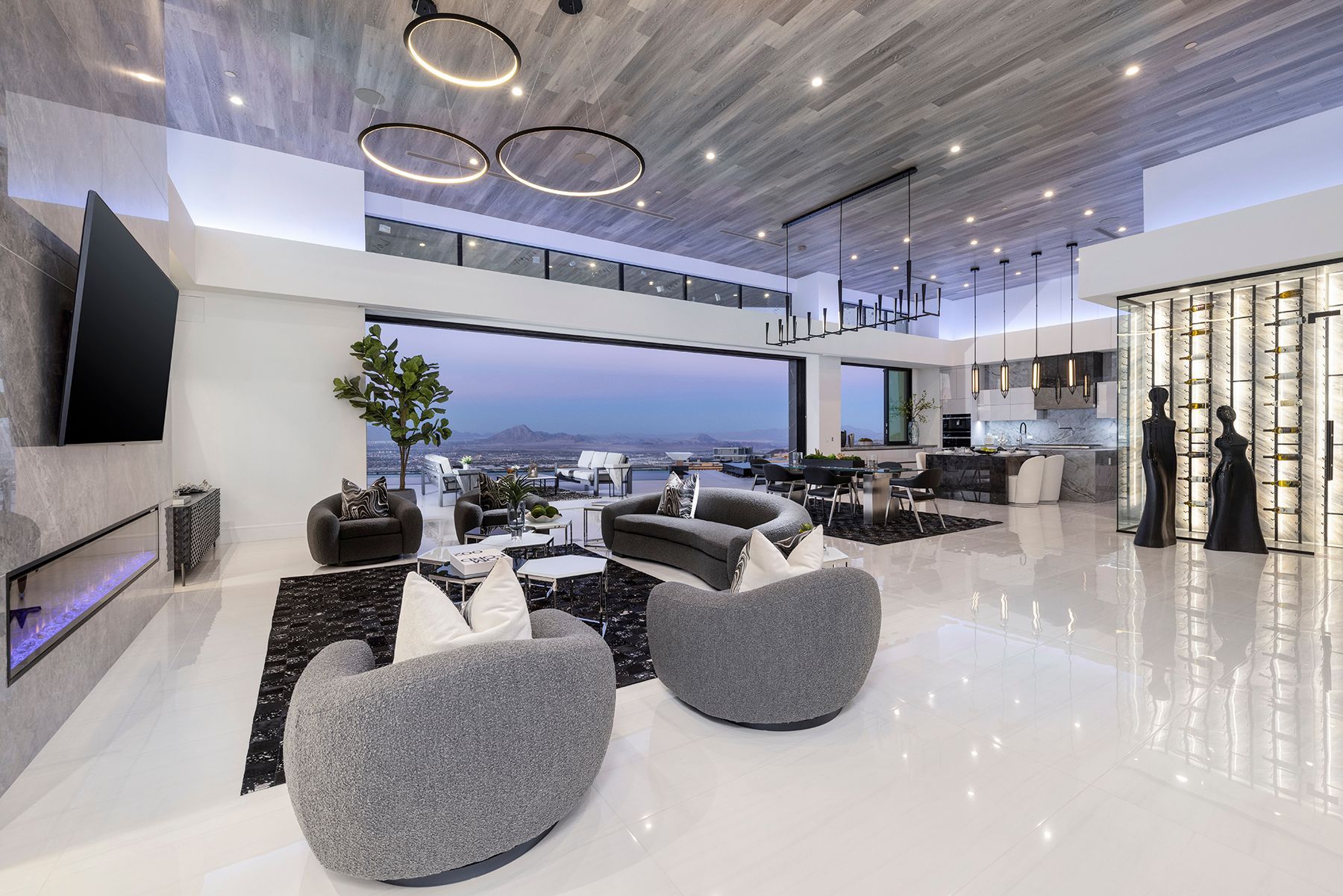 a living room with a lot of furniture and a large window