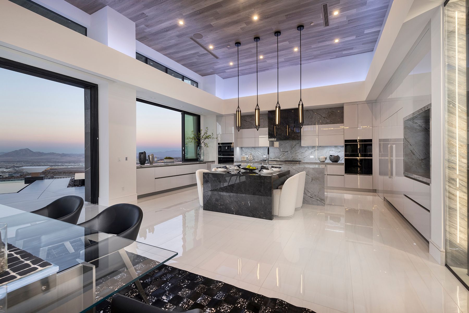 a modern kitchen with a large island in the middle of the room