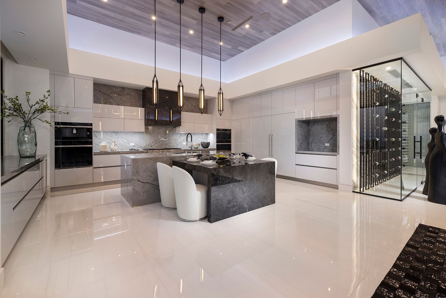 a kitchen with a large island and a wine cellar