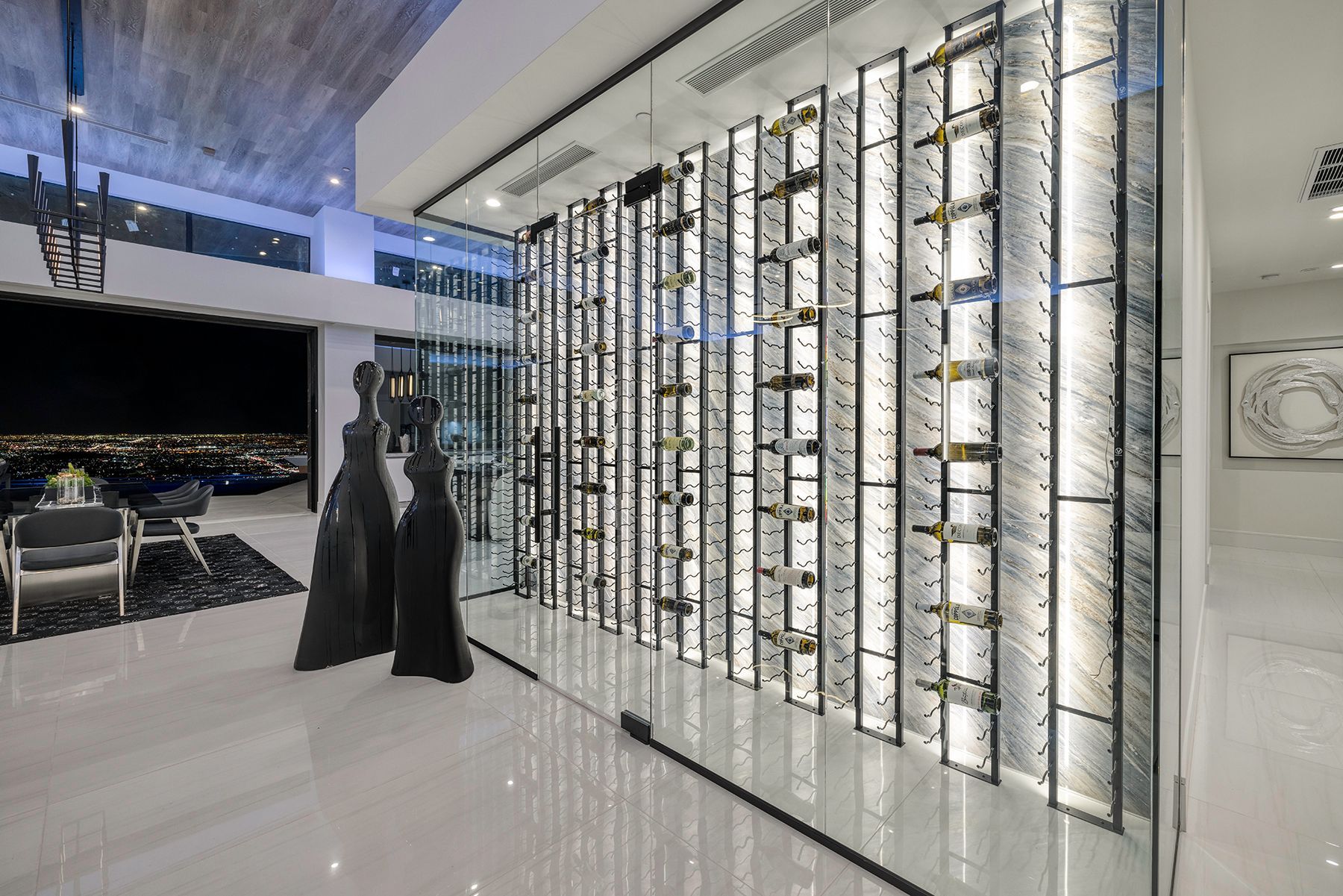 a large wine cellar with many wine bottles hanging on the wall