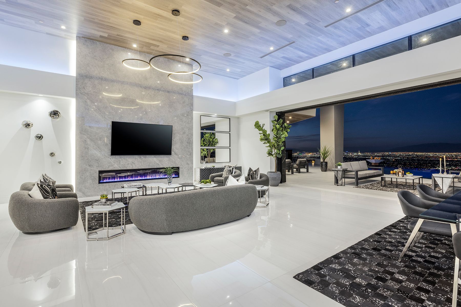 a living room with a couch, chairs, and a flat-screen tv