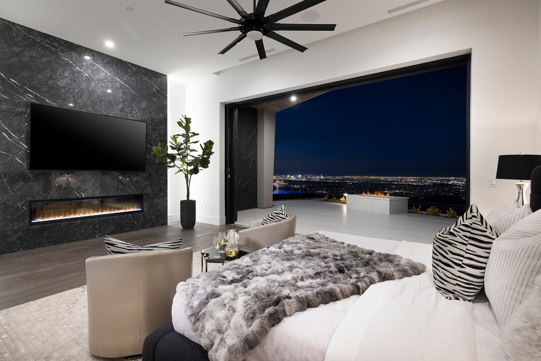 a bedroom with a large bed and a flat screen tv