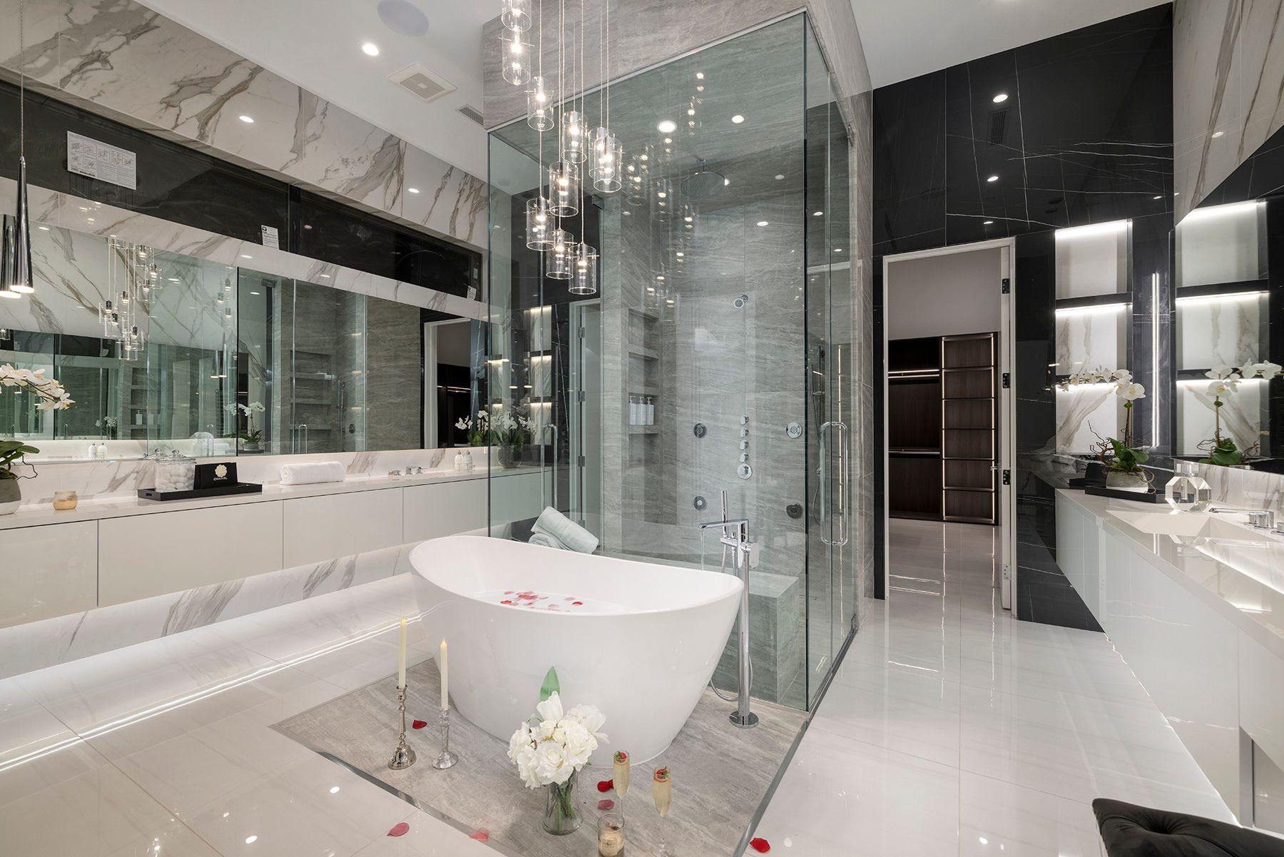 a bathroom with a bathtub and a walk-in shower