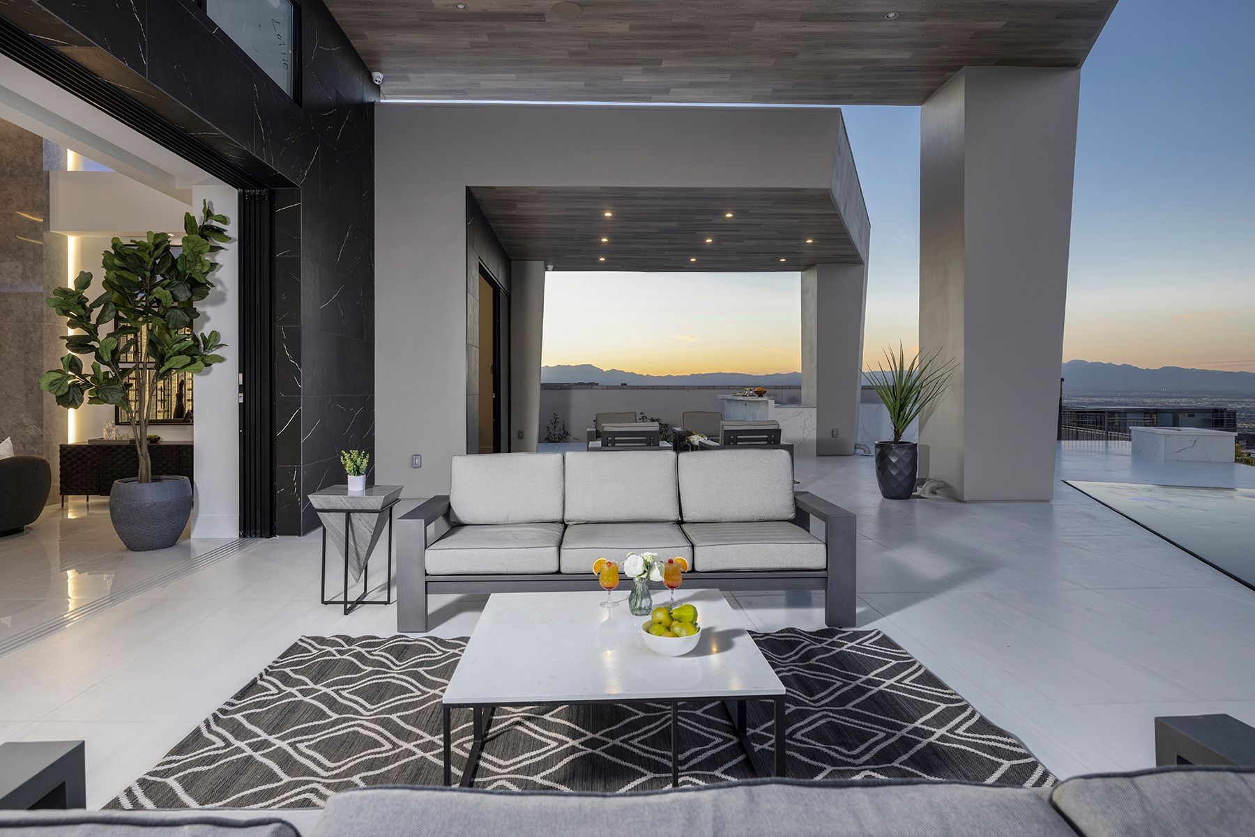 a patio with a couch and a coffee table