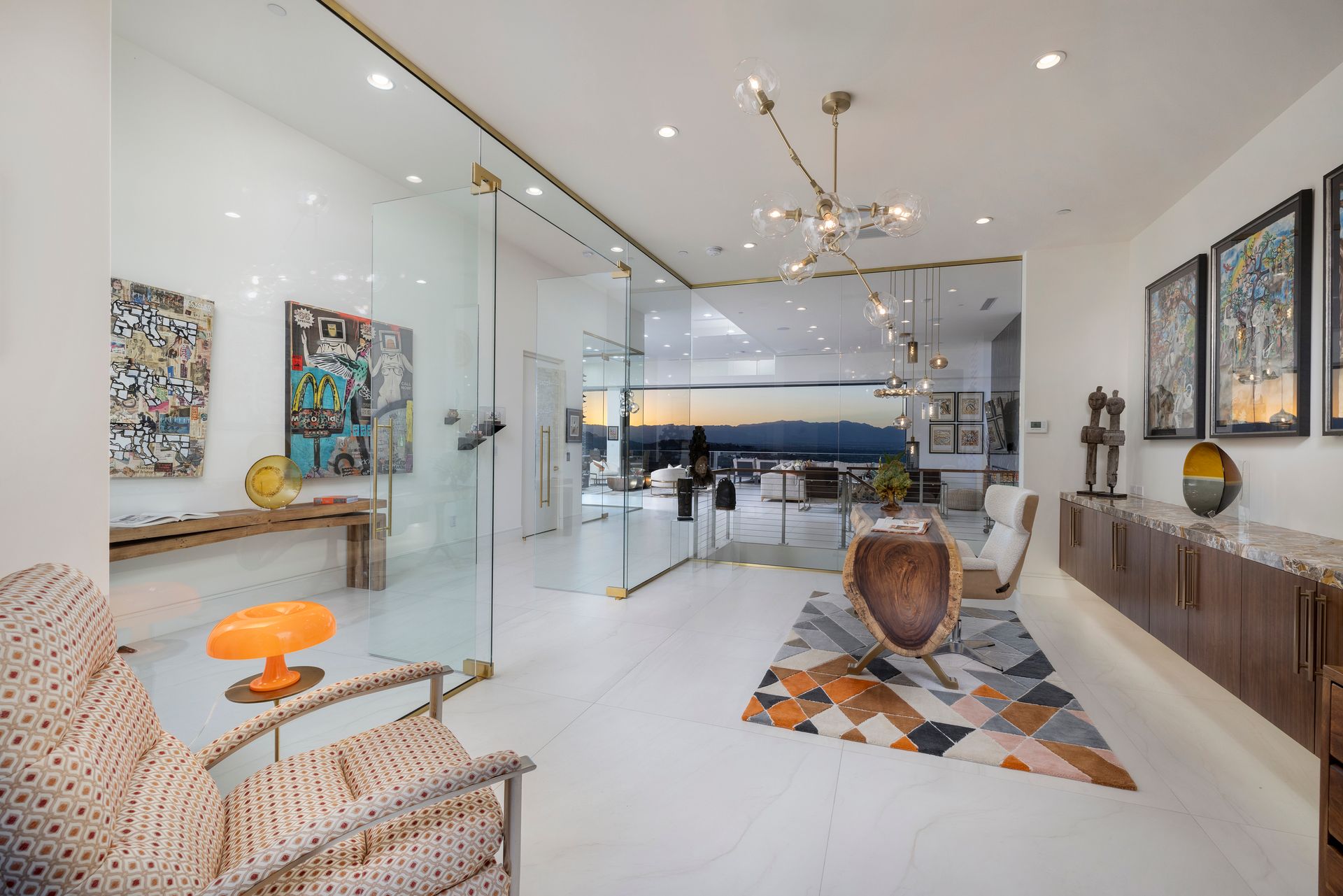 a room with glass walls and a table and chairs